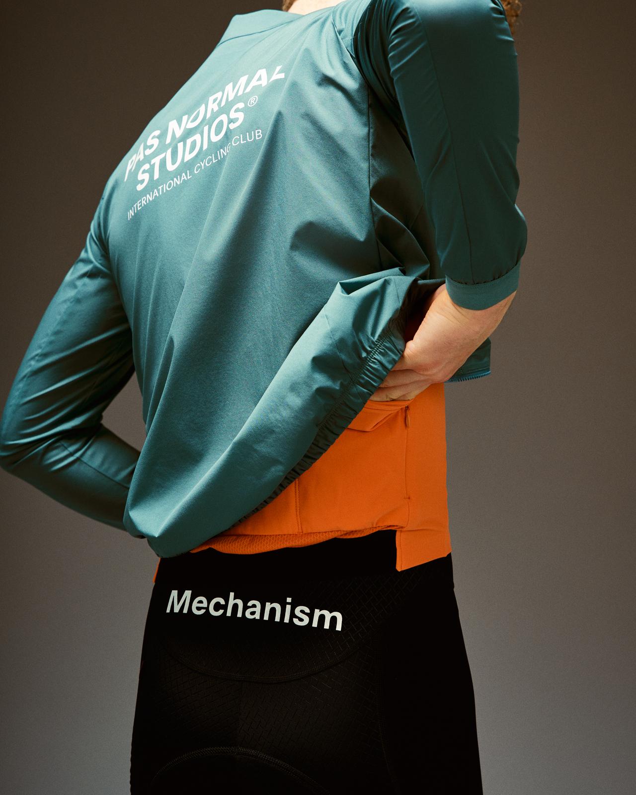 Pas Normal Studios - Men's Mechanism Stow Away Jacket - Grey Teal - Nuremberg Germany - Rear view on model