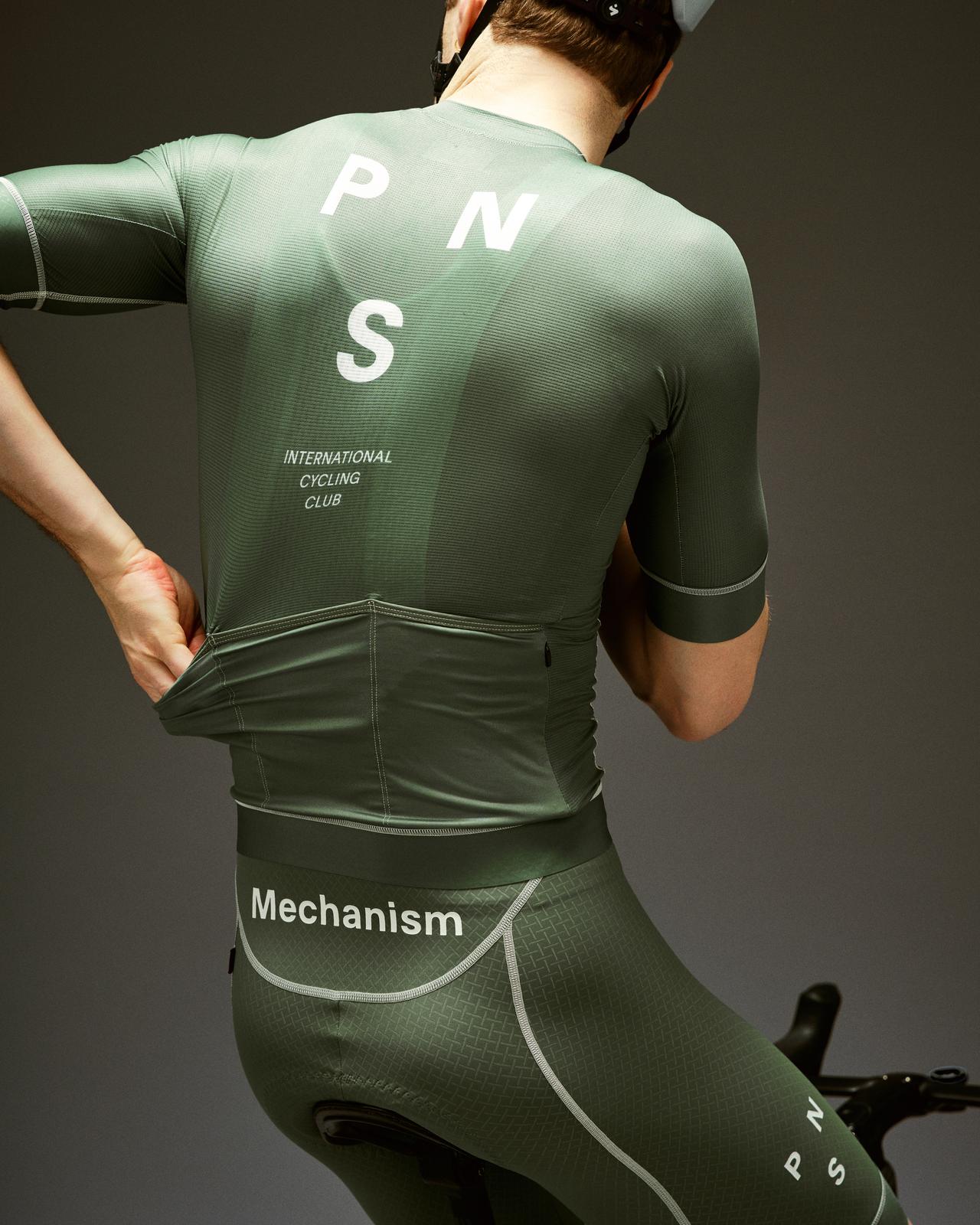 Pas Normal Studios - Mechanism Bibs - Khaki Green - Nuremberg Germany - Rear view on model