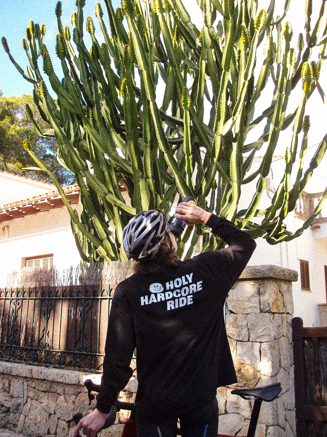 Holy Hardcore Ride Oversized Logo Long Sleeve Tee - Black - Nuremberg Germany - Back view on bike