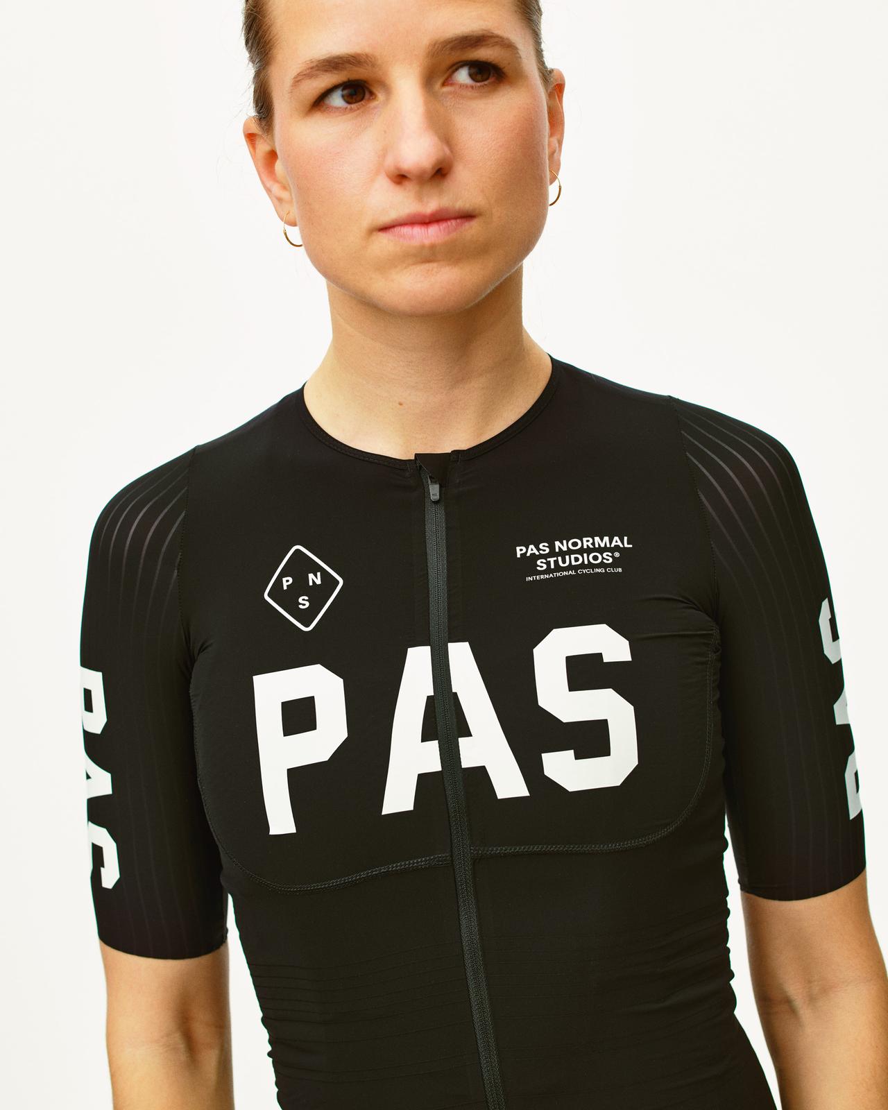 Pas Normal Studios - Women's PAS Mechanism Pro Jersey - Black - Nuremberg, Germany - Front View on model