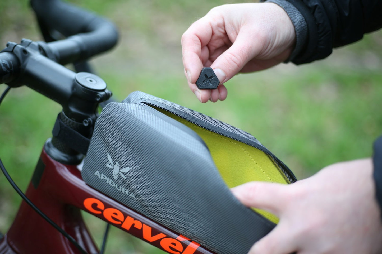 APIDURA - Expedition Bolt-On Top Tube Pack (1L) - Nuremberg, Germany - Side View on bike, bolts outside
